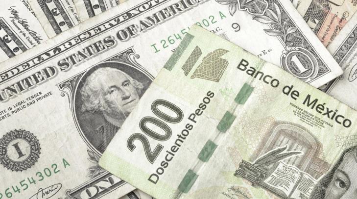 Baja el dólar a 18.75 pesos a media jornada electoral en EU