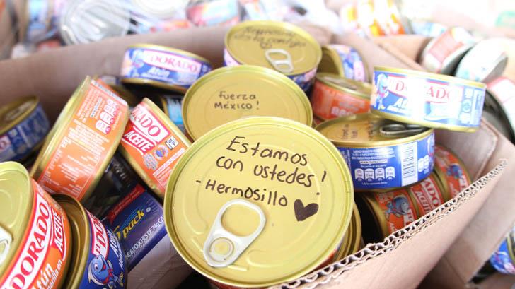 Hermosillenses escriben mensajes de aliento en latas que envían a afectados por sismo